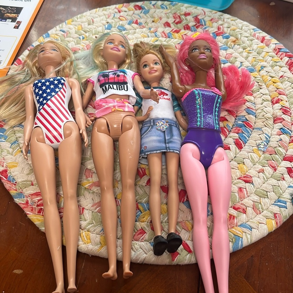 Set of 4 Barbies, in great condition